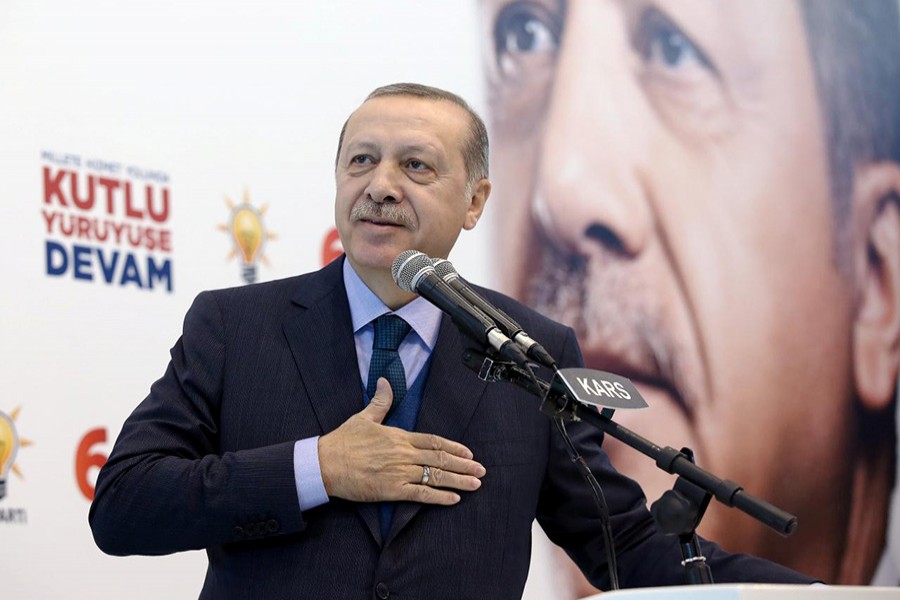 Turkish President Tayyip Erdogan greets his supporters during a meeting of his ruling AK Party in Kars, Turkey on Saturday. - Reuters fphoto