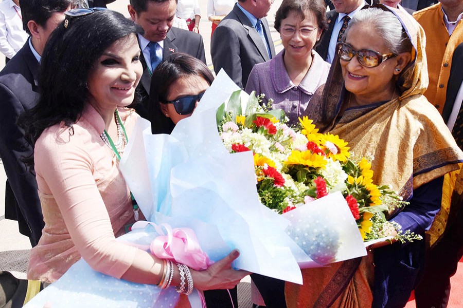 Bangladesh Ambassador to Cambodia Saida Muna Tasnim  greets Prime Minister Sheikh Hasina after her arrival at Phnom Penh International Airport on Sunday. - Focus Bangla photo