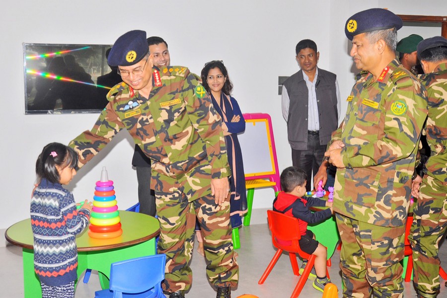 Chief of Army Staff General Abu Belal Muhammad Shafiul Huq, SBP, ndc, psc, talking to a child after inaugurating the BUP Daycare Centre at Mirpur Cantonment in the city on Tuesday.	— ISPR Photo