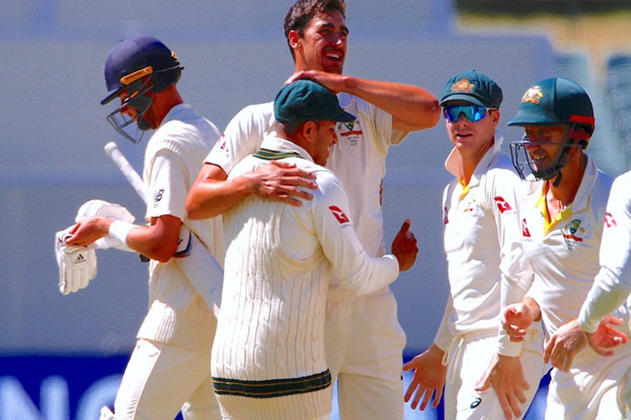 Australia's Mitchell Starc celebrates with team mates after dismissing England's Stuart Broad during the fifth day of the second Ashes cricket test match. Reuters