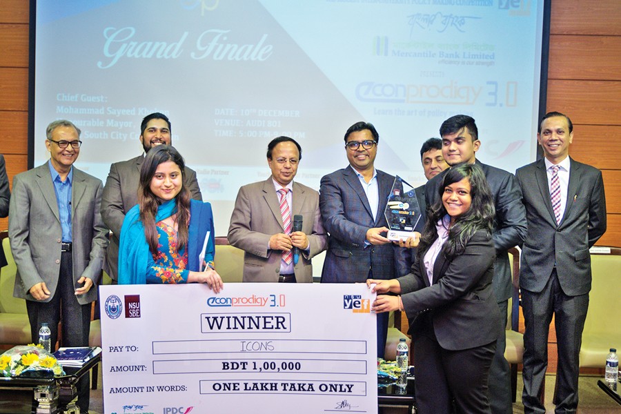 Team Icons of North South University receiving the champion award from the guests of the finale