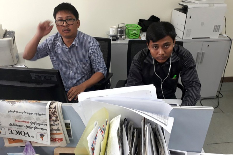 Reuters journalists Wa Lone (L) and Kyaw Soe Oo, who are based in Myanmar, pose for a picture at the Reuters office in Yangon, Myanmar on Monday. - Reuters photo