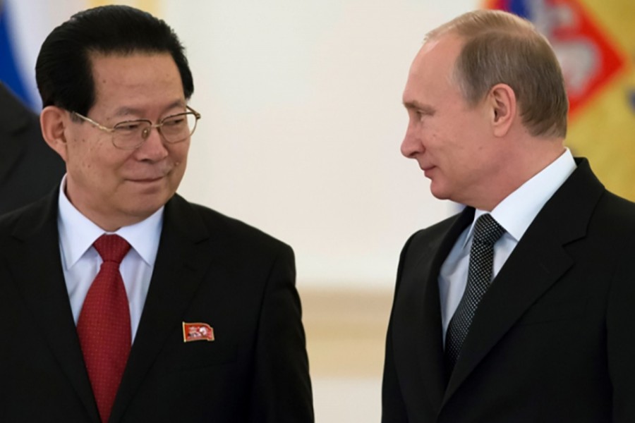 Russian President Vladimir Putin (R) and North Korea's Ambassador Kim Hyun-joon attend a ceremony in Moscow, Russia. - Reuters file photo