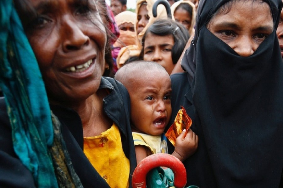 A Rohingya Hindu refugee child cries inside the Kutupalong Hindu refugee camp near Cox's Bazar, Bangladesh, December 17, 2017. Reuters