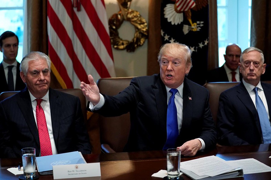 US President Donald Trump (C) excuses reporters after his remarks to them at the start of a cabinet meeting at the White House in Washington, US on Wednesday. - Reuters photo