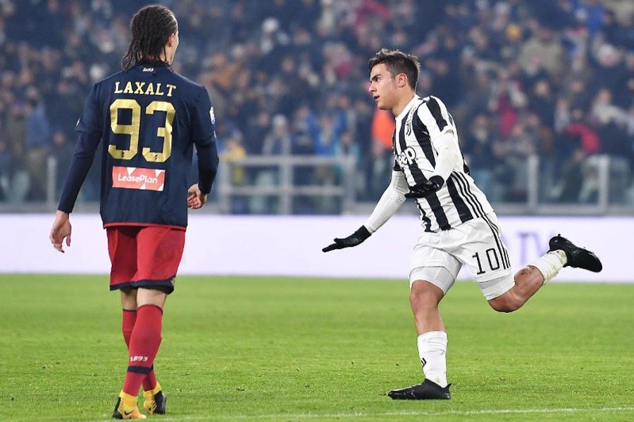 Juventus' Paulo Dybala celebrates after scoring his team's first goal during an Italian Cup round of 16 soccer match between Juventus and Genoa at Turin's Allians Stadium on Wednesday.	— AP