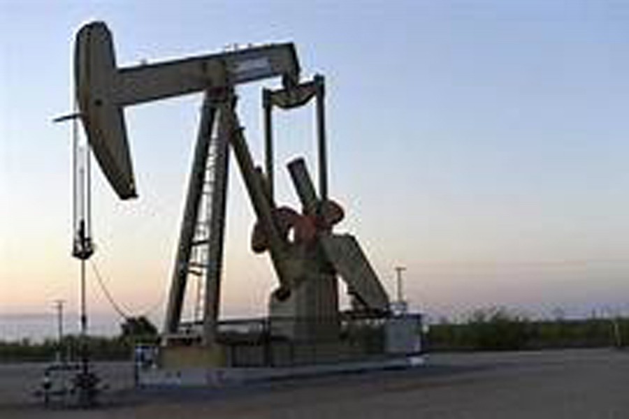 A pump jack operates at a well site leased by Devon Energy Production Company near Guthrie, Oklahoma, US. 	Reuters