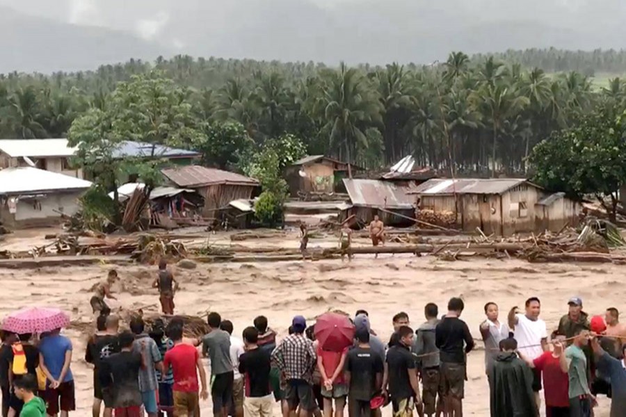 People attempt to rescue flood victims in Lanao Del Norte, Philippines on Friday last. - via Reuters