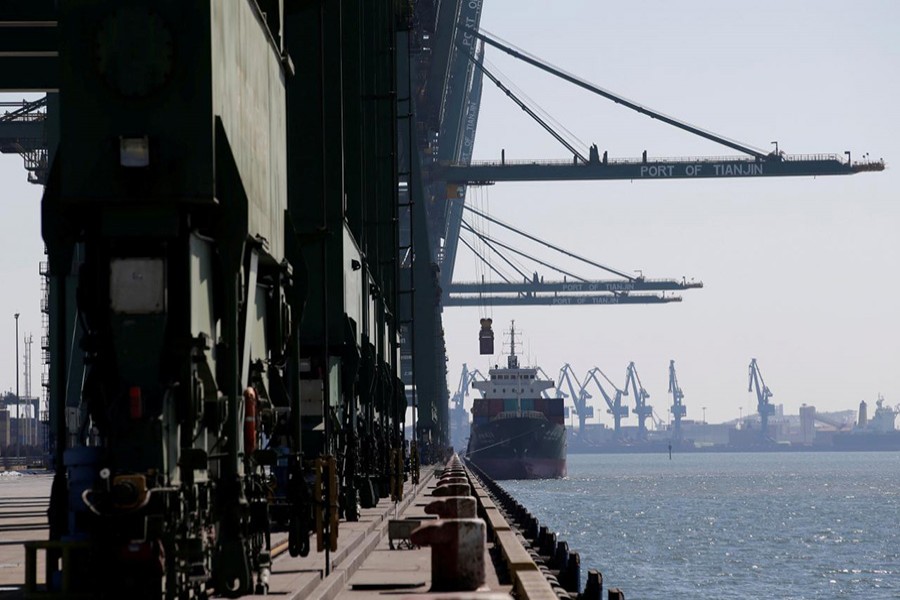 A container is carried away from a cargo ship at Tianjin Port, in northern China February 23, 2017. - Reuters file photo