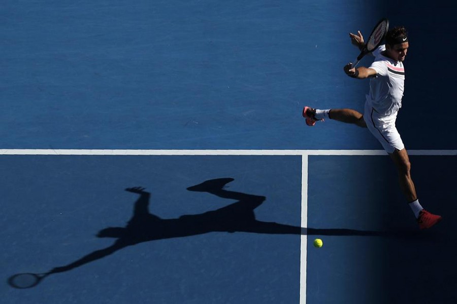 Roger Federer of Switzerland hits a shot against Marton Fucsovics of Hungary. - Reuters photo