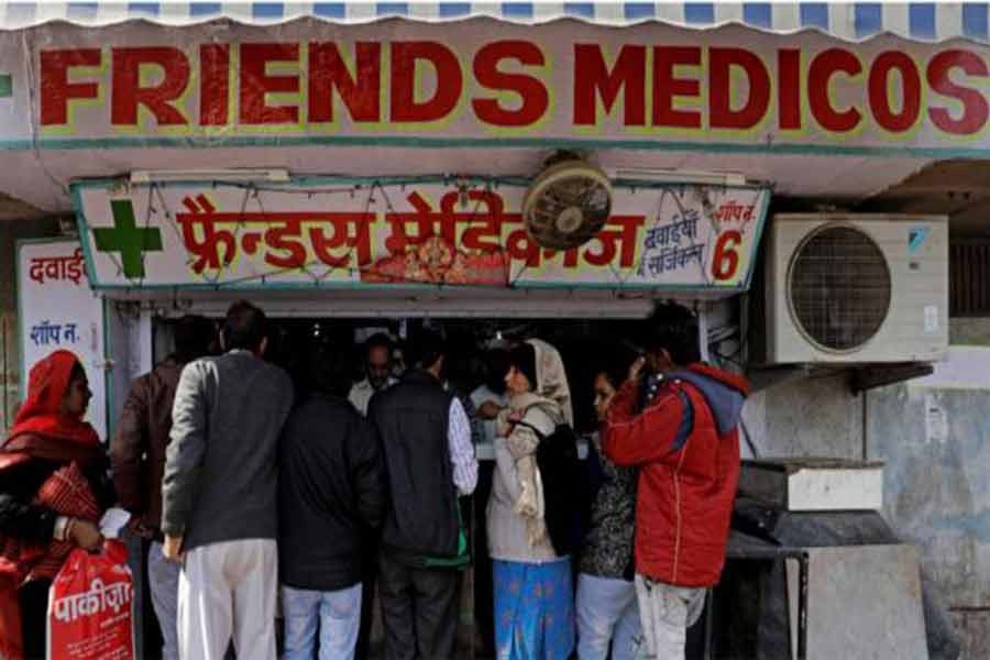 People crowd outside a chemist store in New Delhi, India February 2, 2018. Photo: Reuters