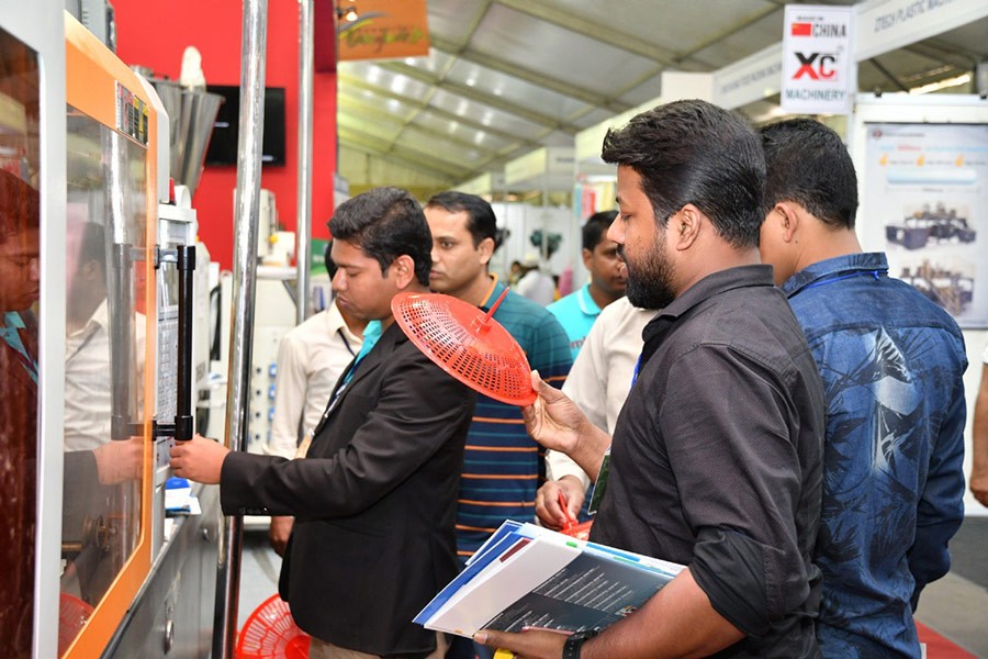 Visitor looks at plastic products in the 13th International Plastic Fair at BICC in the city. Courtesy: Bangla Expo