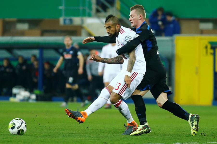 DFB Cup - SC Paderborn 07 vs Bayern Munich - Benteler Arena, Paderborn, Germany - February 6, 2018. Bayern Munich's Arturo Vidal in action with Paderborn’s Marlon Ritter. (REUTERS)