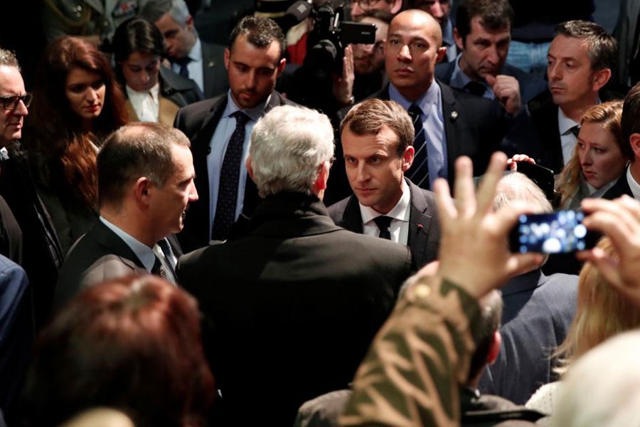 French President Emmanuel Macron talks with President of the Corsican executive council, Gilles Simeoni at the Alb'Oru cultural centre in Bastia, on the French Mediterranean island of Corsica, February 7, 2018. (REUTERS)