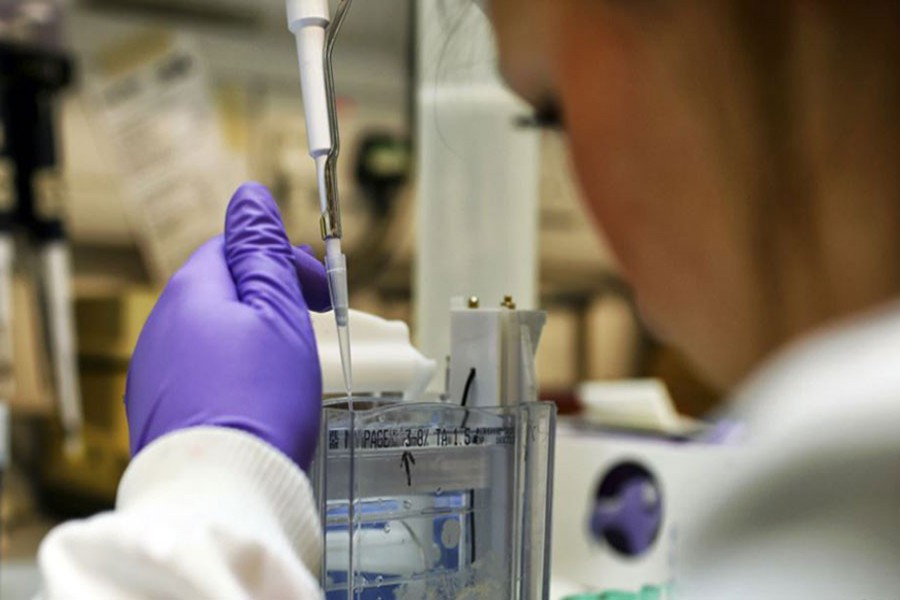 A scientist studies proteins in a lab at the Institute of Cancer Research in Sutton, England. Reuters Photo