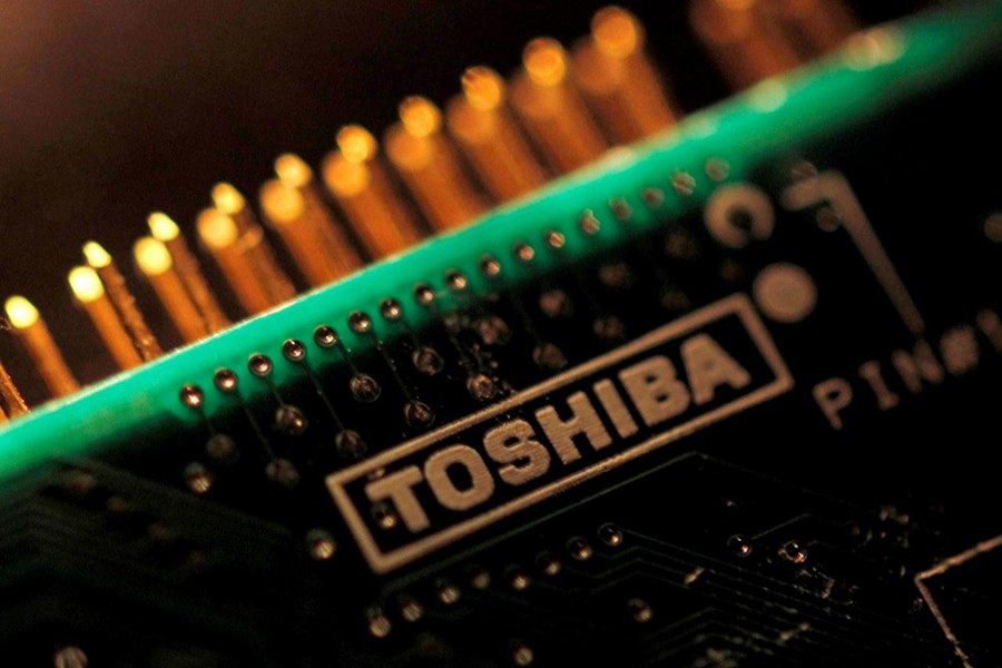 A logo of Toshiba Corp is seen on a printed circuit board in this photo illustration taken in Tokyo on July 31, 2012. - Reuters file photo