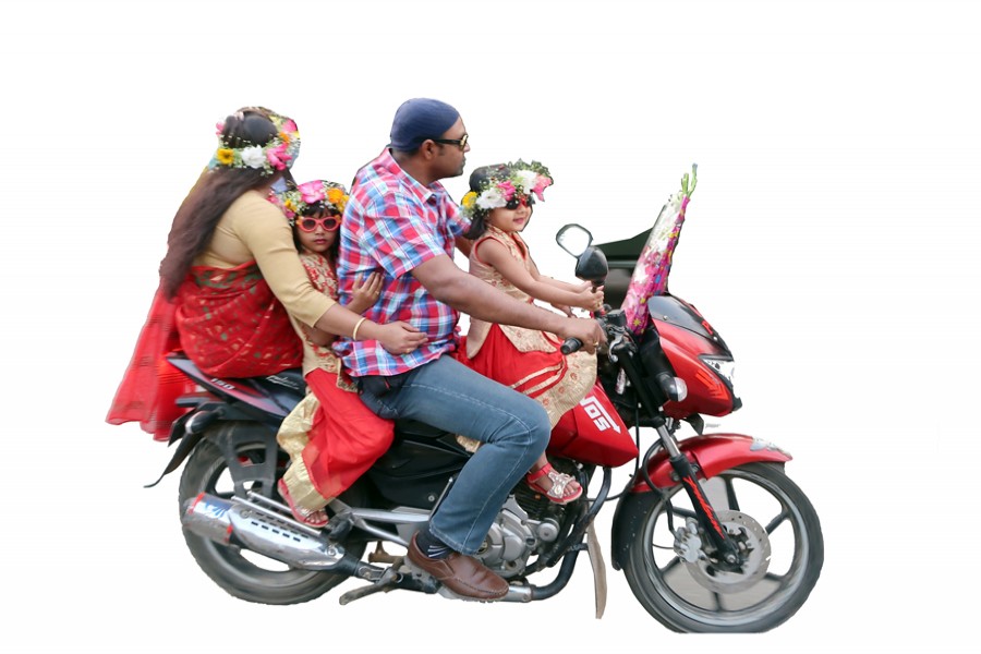 A family hitches a bike ride on the Valentine’s Day in the city. —FE Photo by Shafiqul Alam