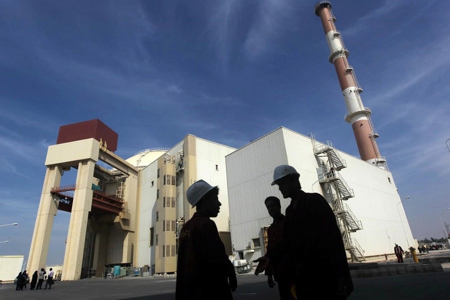 Iranian workers stand in front of the Bushehr nuclear power plant, about 1,200 km (746 miles) south of Tehran, Iran, October 26, 2010. Reuters/File Photo