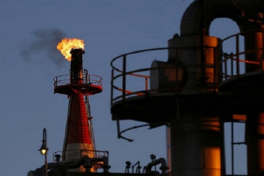 A flame shoots out of a chimney at a petro-industrial factory in Kawasaki near Tokyo December 18, 2014. Reuters/Files