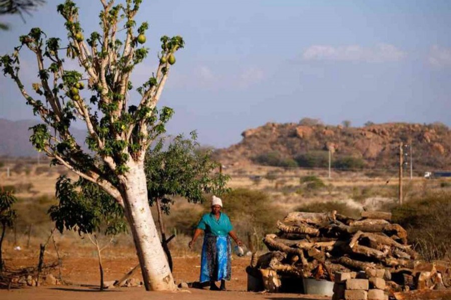 A woman looks on at her home in Mapela village oustde the Mogalakwena platinum mine in Mokopane, Limpopo province, South Africa on September 19, 2017. - Reuters file photo