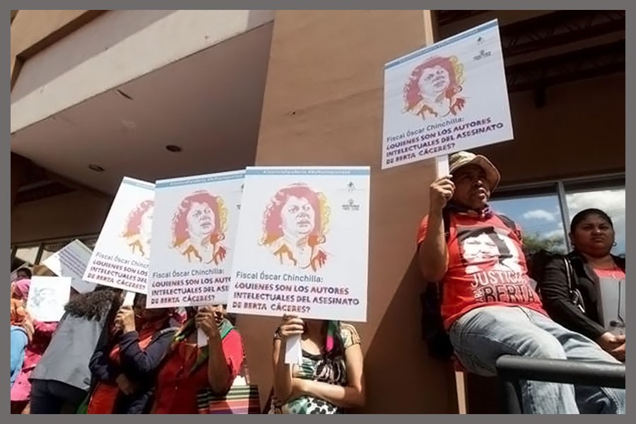 Lenca indigenous hold placards during a protest to mark the second anniversary of the killing of environmental activist Berta Caceres, in Tegucigalpa, Honduras March 2, 2018. Reuters.