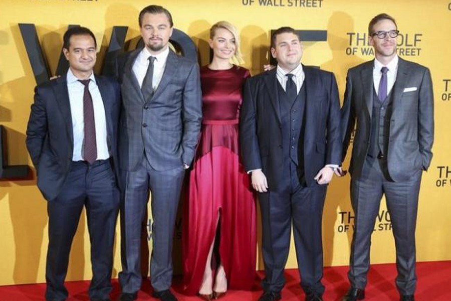 Producer Riza Aziz (L-R), Leonardo DiCaprio, Margot Robbie, Jonah Hill and Joey McFarland pose for photo at the "The Wolf of Wall Street" premier in London January 9, 2014. Reuters/File Photo