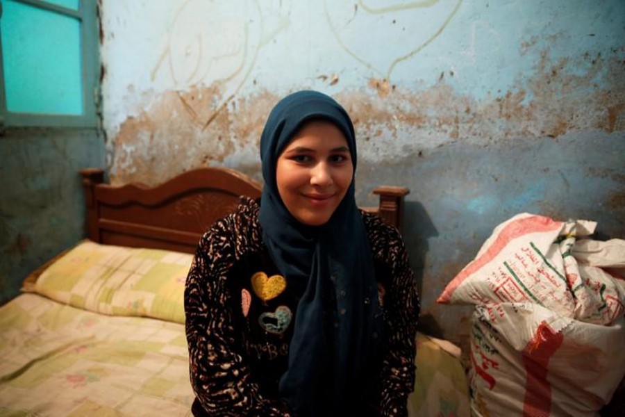 Esraa Salah, 15, looks on at her home in Alwasata village in Egypt, February 8. Reuters/File Photo