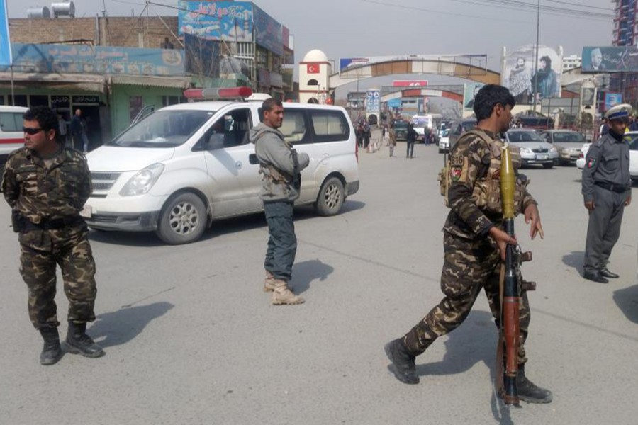 Afghan security forces keep watch near the site of a blast in Kabul, Afghanistan on Friday. - Reuters photo