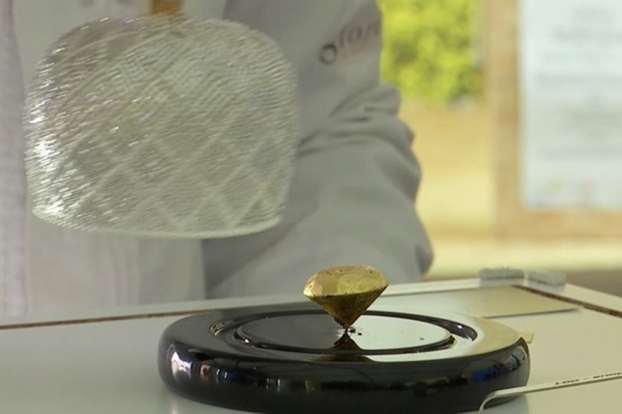 Portuguese chocolatier Daniel Gomes prepares a candy wrapped in pure 23-carat gold during international chocolate fair in Obidos, Portugal, March 16. Reuters/File Photo