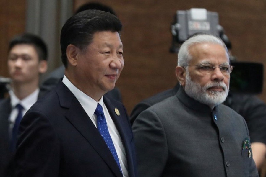 Chinese President Xi Jinping (L) and Indian Prime Minister Narendra Modi, arrive for the 'Dialogue of Emerging Market and Developing Countries' on the sidelines of the 2017 BRICS Summit in Xiamen, Fujian province, China, 05 September 2017. Reuters/Files