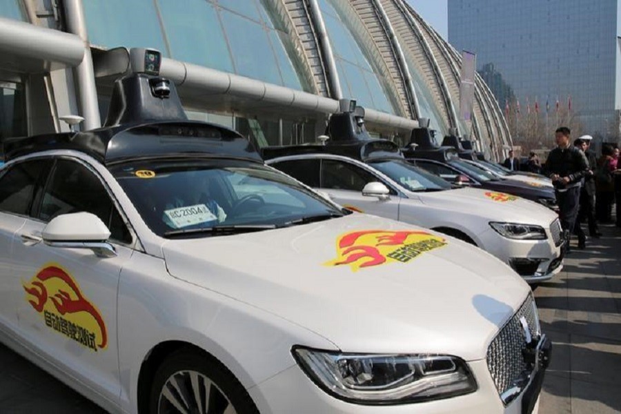 Baidu's Apollo autonomous cars are seen during a public road test for self- driving vehicles in Beijing, China March 22, 2018. Reuters