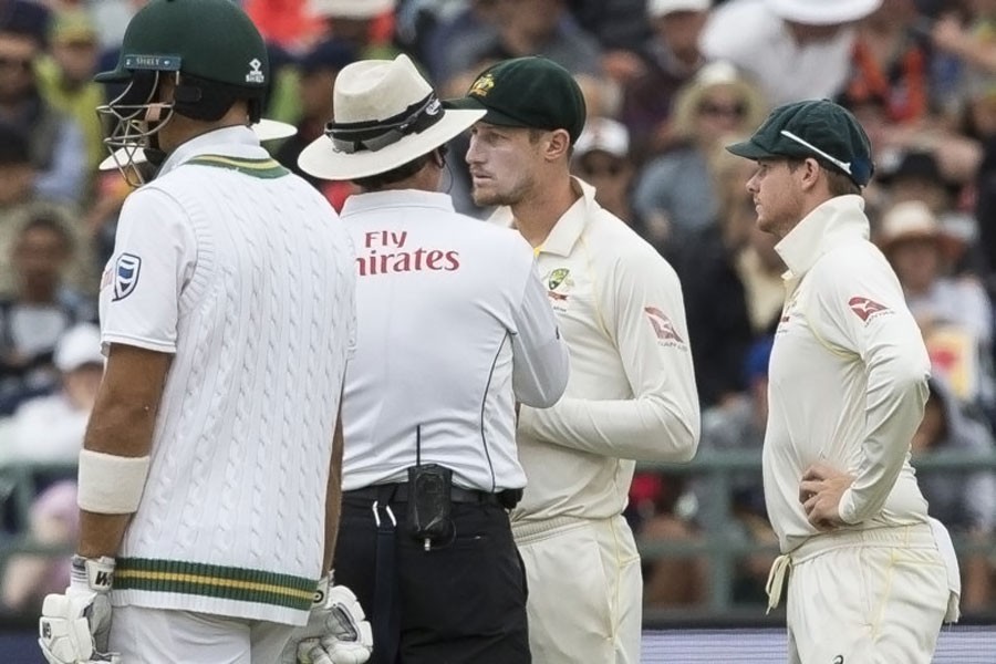 Cameron Bancroft of Australia talks to the umpire on the third day of the third cricket test between South Africa and Australia at Newlands Stadium, in Cape Town, South Africa, Saturday, March 24, 2018. AP Photo.