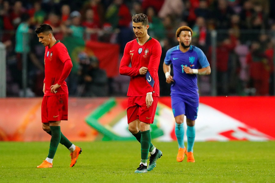 Cristiano Ronaldo (C) cuts a dejected figure during clash against Netherlands on Monday - Reuters photo