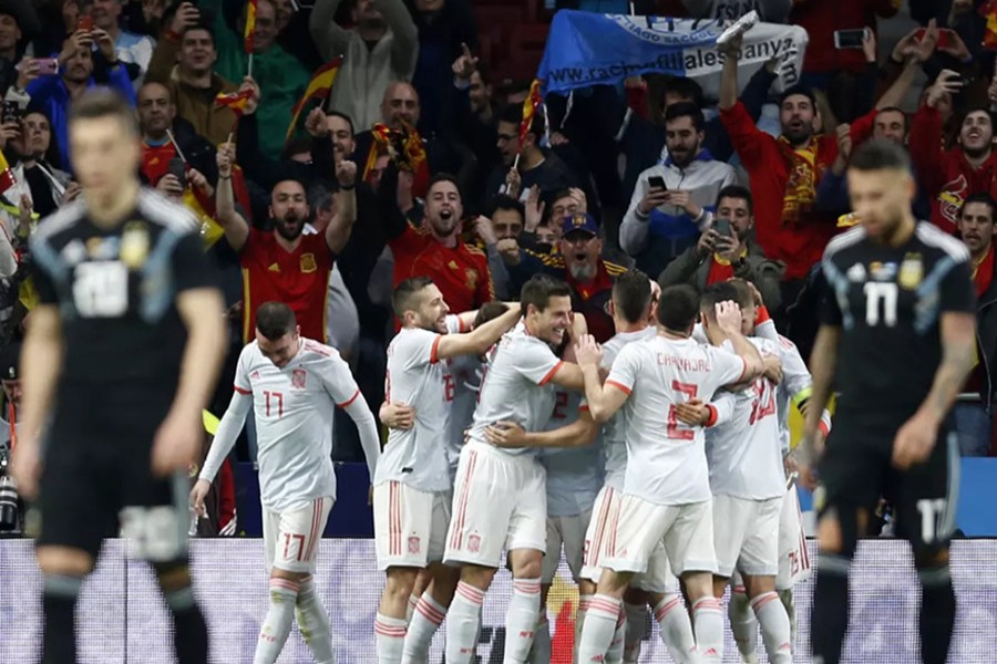 The players of Argentina (Black kits) look dejected as Spain celebrate a goal scored during a friendly match at Wanda Metropolitano on Tuesday - AP photo