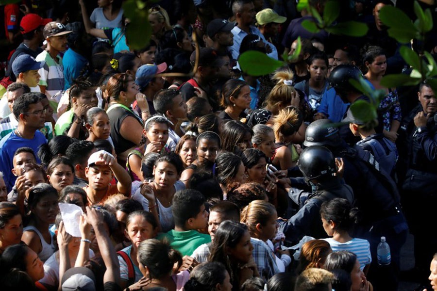 Relatives of inmates at the General Command of the Carabobo Police wait outside the prison in Valencia, Venezuela on Wednesday - Reuters photo