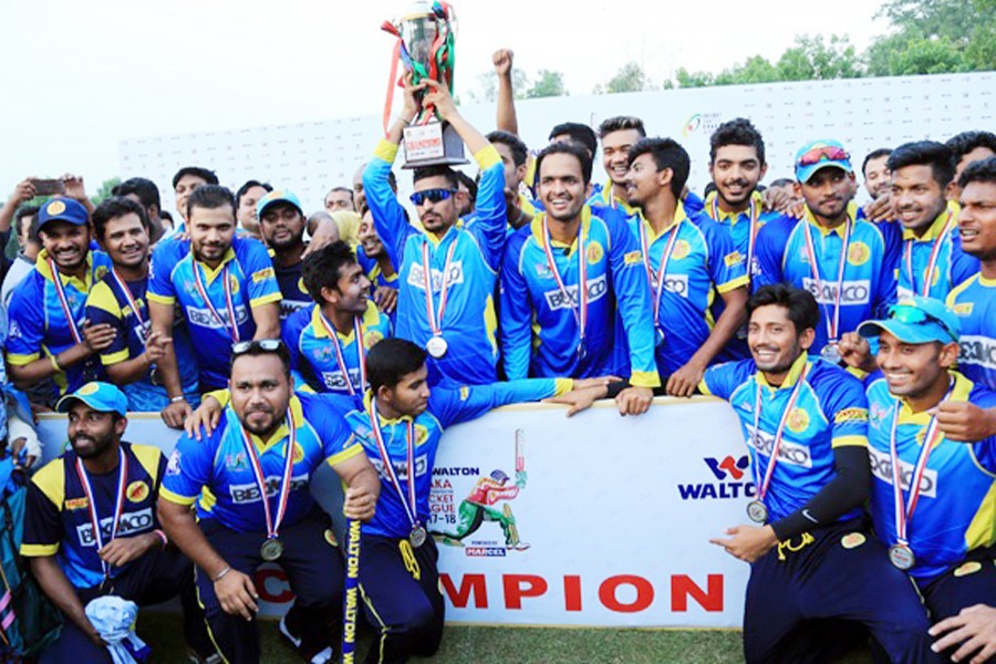 Abahani Limited players posing with the trophy after winning the 19th crown in Premier Division Cricket League at BKSP ground in Savar on Thursday	— bdnews24.com