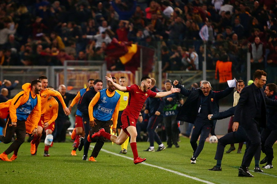 Defender Kostas Manolas (C) celebrates after scoring in the 82nd minute to put Roma 3-0 ahead against Barca in the second-leg.