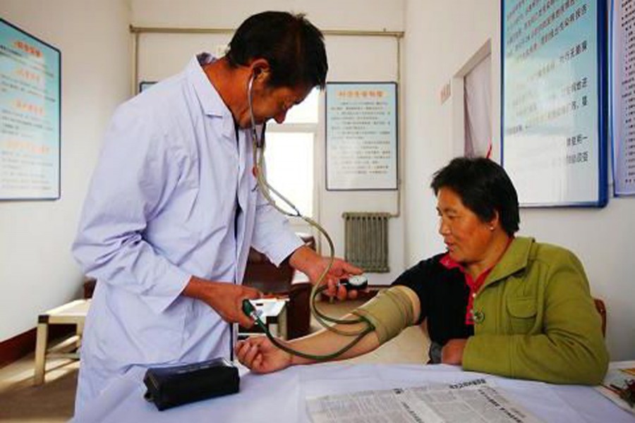 A patient being treated by a doctor in China. Internet Photo