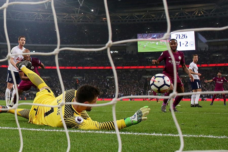 Manchester City's Raheem Sterling scores their third goal in Saturday's clash against Tottenham - Reuters photo