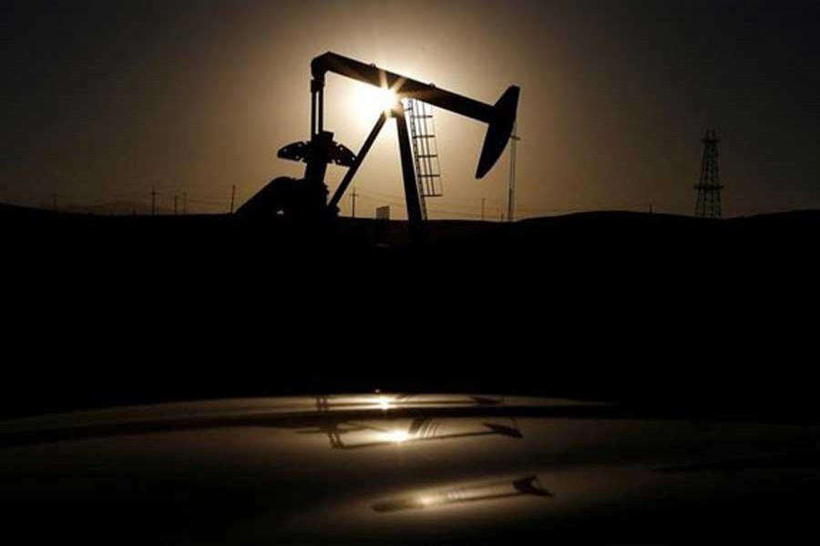 A pump jack is seen at sunrise near Bakersfield, California October 14, 2014. Reuters/Files