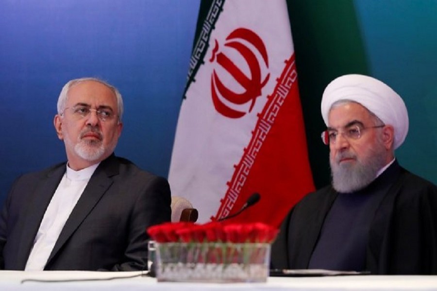 Iranian President Hassan Rouhani (R) and Foreign Minister Mohammad Javad Zarif attend a meeting with Muslim leaders and scholars in Hyderabad, India, February 15, 2018. Reuters/Files