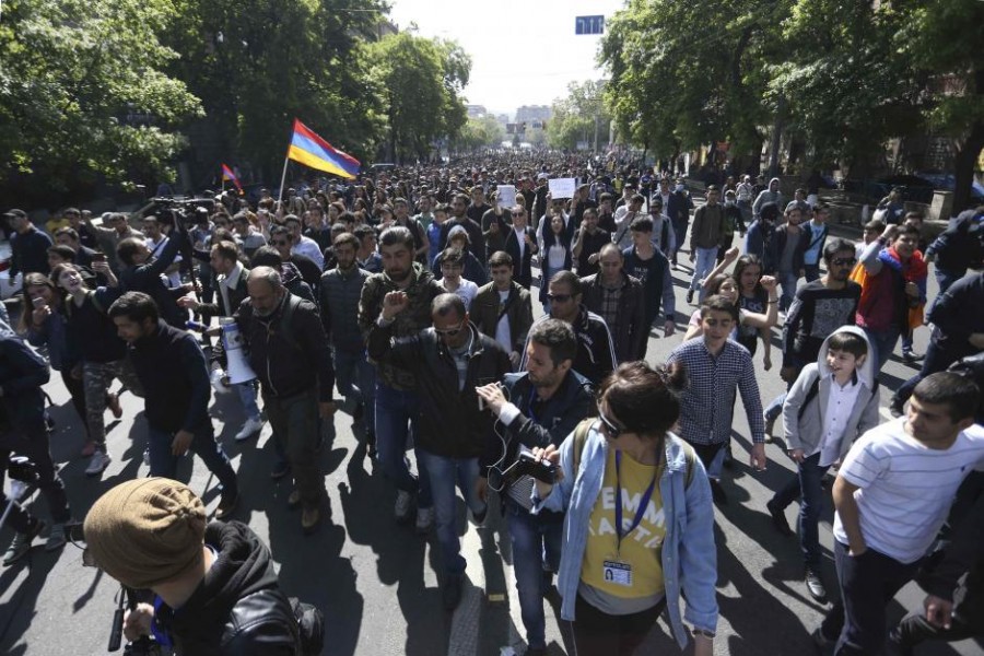 People walk during a protest after parliament voted to allow former President Serzh Sarksyan to become Prime Minister in Yerevan, Armenia April 18, 2018. Reuters.