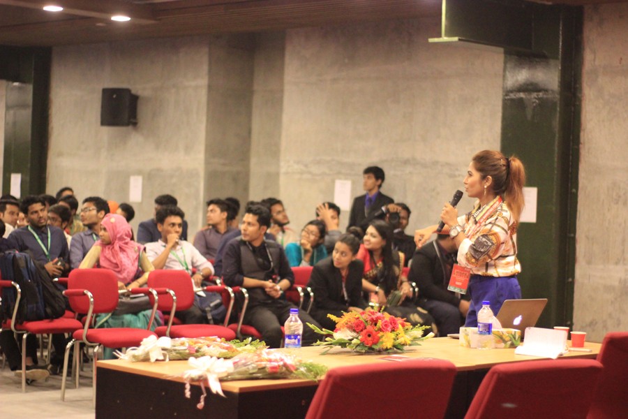 Moderator listening to a participant at the workshop of ‘Brand Master’ organised by United International University Marketing Forum (UIUMF)