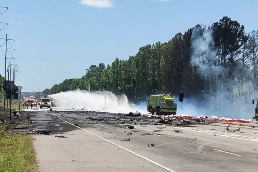 Emergency personnel work at the scene of an Air National Guard C-130 cargo plane that crashed near Savannah, Ga., on May 2, 2018. Savannah Professional Firefighters Association via AP.