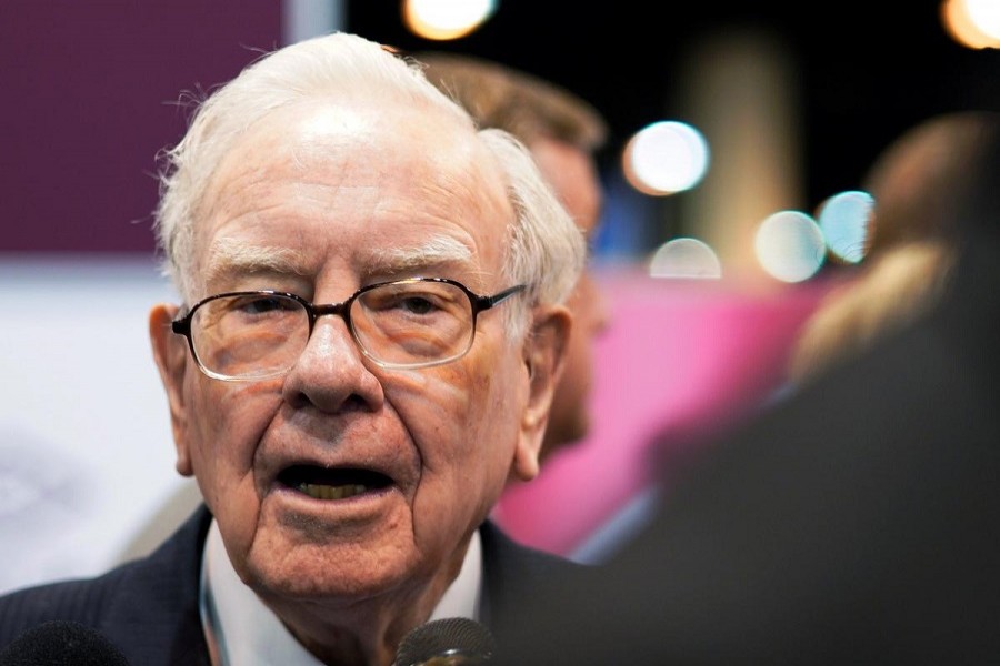 Warren Buffett, CEO of Berkshire Hathaway Inc, talks to a reporter in the exhibit hall at the company's annual meeting in Omaha, Nebraska, US, May 5, 2018. Reuters/Files