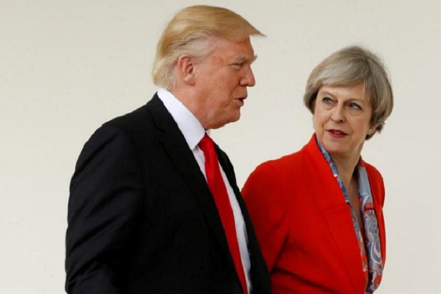 US President Donald Trump escorts British Prime Minister Theresa May after their meeting at the White House in Washington, US, January 27, 2017. Reuters/Files