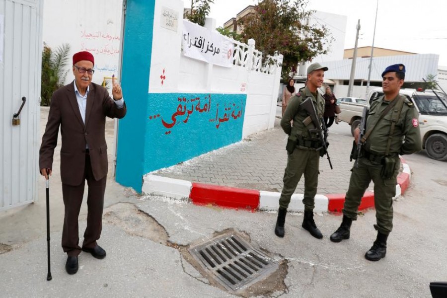 A man raises his ink-stained finger after casting his vote at a polling station for the municipal election in Tunis, Tunisia, May 6, 2018. Reuters photo.