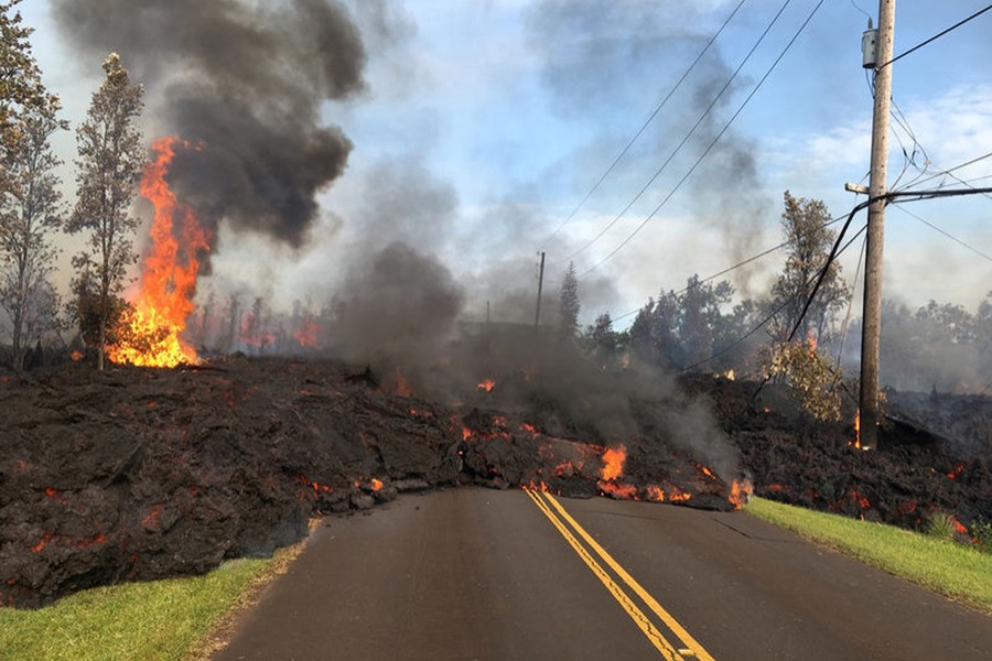 Lava advances along a street near a fissure in Leilani Estates, on Kilauea Volcano's lower East Rift Zone, Hawaii. Reuters/File