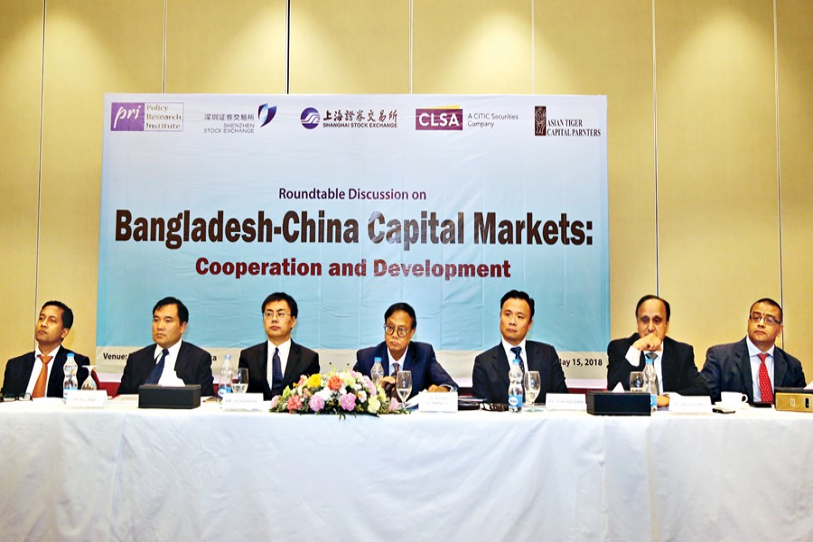 A roundtable on 'Bangladesh-China Capital Markets: Cooperation and Development', jointly organised by Policy Research Institute of Bangladesh (PRI) and Shenzhen-Shanghai stock exchanges, in progress in the capital on Tuesday 	—  FE Photo