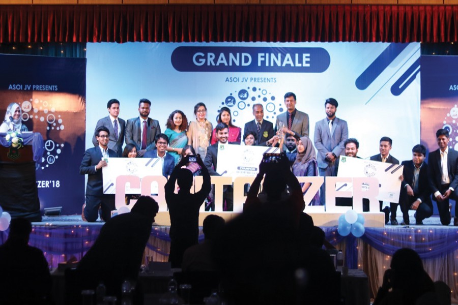 Winners, organisers and guests pose for a photo at the grand finale of 'ASOI JV presents Capitalizer 2018', a capital market-based competition held at Bangladesh University of Professionals